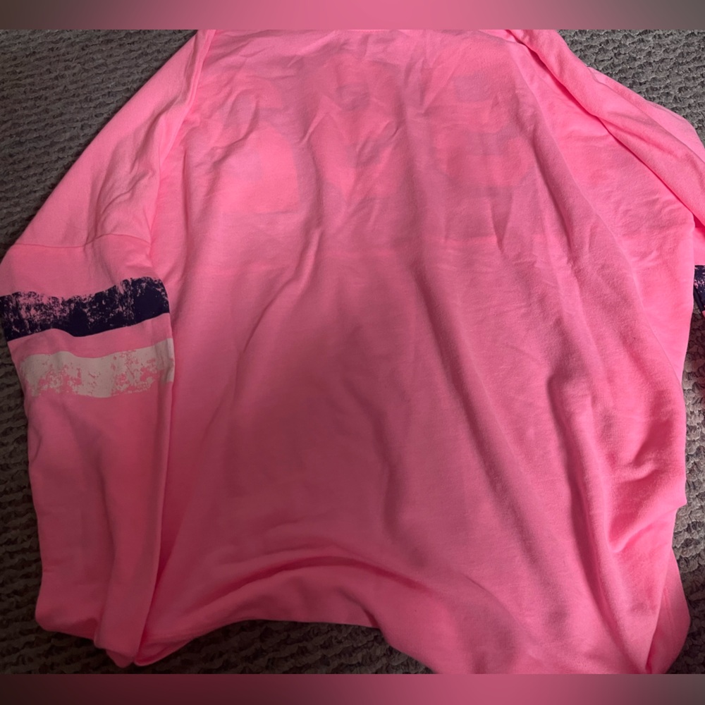 Woman’s bright pink shirt used